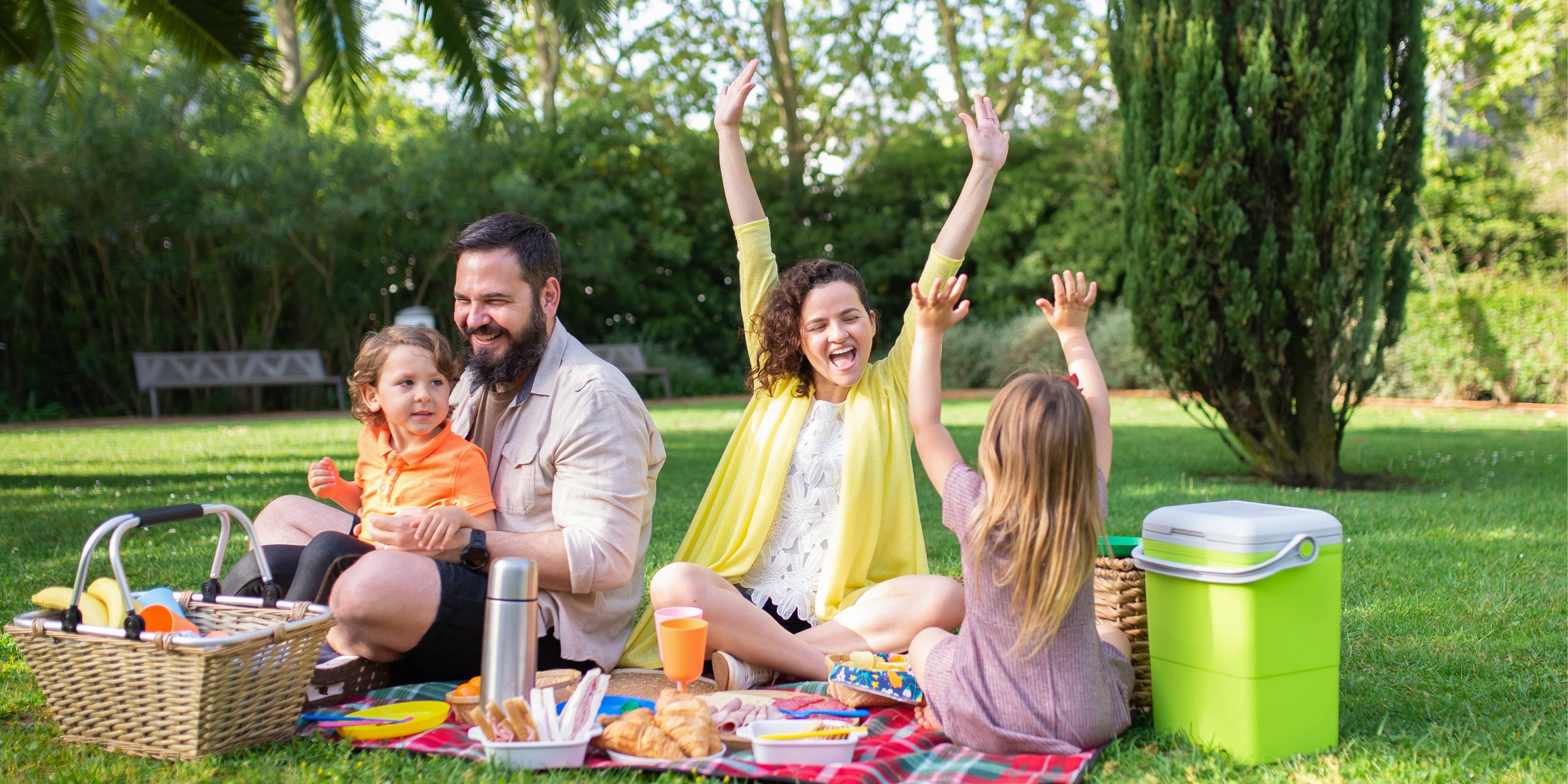 A family having a picnic in the park. 